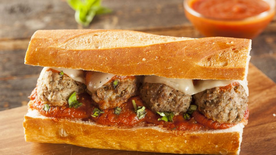 20404427 – homemade spicy meatball sub sandwich with marinara sauce and cheese